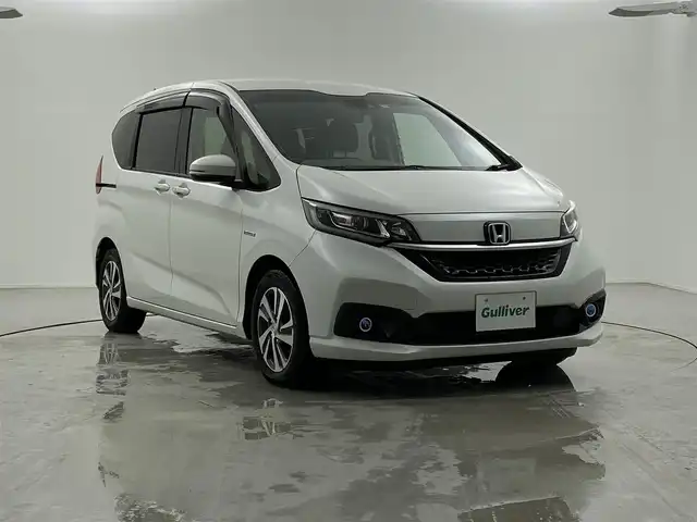 ホンダ フリード ハイブリット G ホンダセンシング 福井県 2019(令1)年 4.6万km プラチナホワイトパール Sパッケージ/-本革巻きステアリング/-コンビシート&専用インテリア/-15インチアルミホイール/-シートバックアッパーポケット/純正9インチプレミアムインターナビ/-AM/FM/DVD/BT/USB/HDMI/フルセグTV/純正ドライブレコーダー前後/純正フロアマット/両側パワースライドドア/バックカメラ/ETC/ハーフレザーシート/シートヒーター/衝突被害軽減システム/レーダークルーズコントロール/レーンキープアシスト/横滑り防止装置/アイドリングストップ/オートLEDライト/ステアリングスイッチ