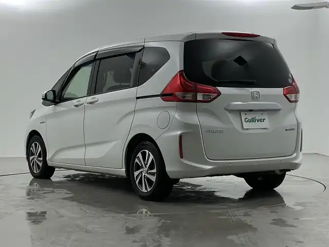 ホンダ フリード ハイブリット G ホンダセンシング 福井県 2019(令1)年 4.6万km プラチナホワイトパール Sパッケージ/-本革巻きステアリング/-コンビシート&専用インテリア/-15インチアルミホイール/-シートバックアッパーポケット/純正9インチプレミアムインターナビ/-AM/FM/DVD/BT/USB/HDMI/フルセグTV/純正ドライブレコーダー前後/純正フロアマット/両側パワースライドドア/バックカメラ/ETC/ハーフレザーシート/シートヒーター/衝突被害軽減システム/レーダークルーズコントロール/レーンキープアシスト/横滑り防止装置/アイドリングストップ/オートLEDライト/ステアリングスイッチ
