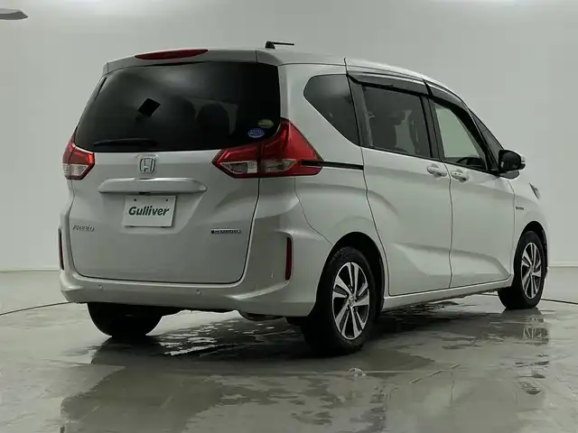 ホンダ フリード ハイブリット G ホンダセンシング 福井県 2019(令1)年 4.6万km プラチナホワイトパール Sパッケージ/-本革巻きステアリング/-コンビシート&専用インテリア/-15インチアルミホイール/-シートバックアッパーポケット/純正9インチプレミアムインターナビ/-AM/FM/DVD/BT/USB/HDMI/フルセグTV/純正ドライブレコーダー前後/純正フロアマット/両側パワースライドドア/バックカメラ/ETC/ハーフレザーシート/シートヒーター/衝突被害軽減システム/レーダークルーズコントロール/レーンキープアシスト/横滑り防止装置/アイドリングストップ/オートLEDライト/ステアリングスイッチ