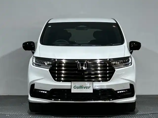 ホンダ オデッセイ ハイブリッド e:HEVアブソルート EXブラックED 愛媛県 2023(令5)年 0.3万km プラチナホワイトパール 純正１１インチナビ（フルセグＴＶ　Ｂｌｕｅｔｏｏｔｈ　ＣＤ　ＤＶＤ　ＳＤ）マルチビューカメラ　本革シート　両側パワースライドドア　オットマン　ＥＴＣ　シートヒーター　ワイヤレス充電　ＬＥＤヘッド