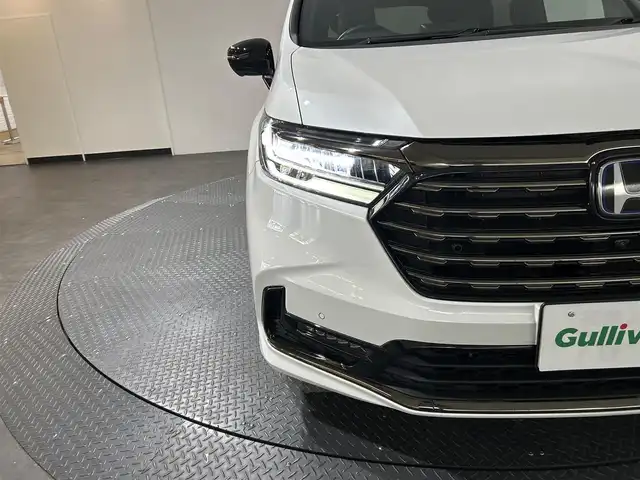 ホンダ オデッセイ ハイブリッド e:HEVアブソルート EXブラックED 愛媛県 2023(令5)年 0.3万km プラチナホワイトパール 純正１１インチナビ（フルセグＴＶ　Ｂｌｕｅｔｏｏｔｈ　ＣＤ　ＤＶＤ　ＳＤ）マルチビューカメラ　本革シート　両側パワースライドドア　オットマン　ＥＴＣ　シートヒーター　ワイヤレス充電　ＬＥＤヘッド