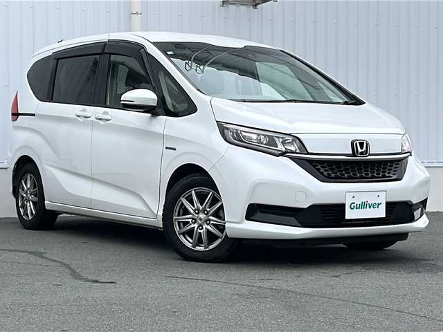 ホンダ フリード ハイブリット G ホンダセンシング 三重県 2020(令2)年 4.4万km プラチナホワイトパール 純正ナビ　/バックカメラ　/前席シートヒーター　/ホンダセンシング　/スペアキー/両側パワースライドドア/ビルトインＥＴＣ　/前後ドライブレコーダー/コーナーセンサー/レーダークルーズコントロール/レーンキープアシスト/LEDヘッドライト/オートライト/純正フロアマット/ステアリングスイッチ /電動格納ミラー /禁煙車