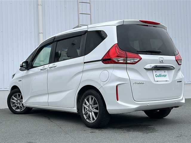 ホンダ フリード ハイブリット G ホンダセンシング 三重県 2020(令2)年 4.4万km プラチナホワイトパール 純正ナビ　/バックカメラ　/前席シートヒーター　/ホンダセンシング　/スペアキー/両側パワースライドドア/ビルトインＥＴＣ　/前後ドライブレコーダー/コーナーセンサー/レーダークルーズコントロール/レーンキープアシスト/LEDヘッドライト/オートライト/純正フロアマット/ステアリングスイッチ /電動格納ミラー /禁煙車