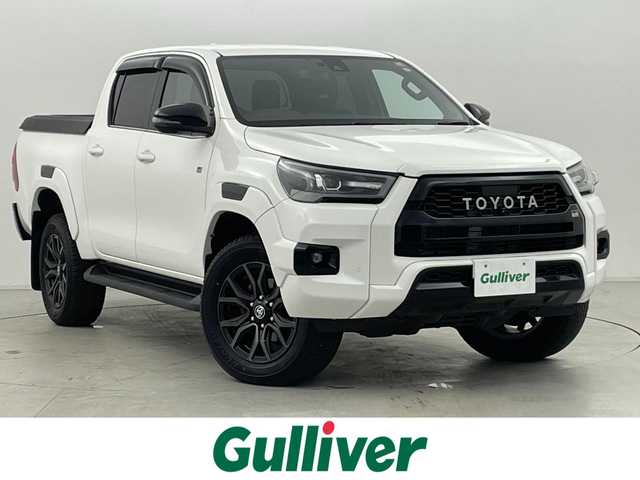 トヨタ ハイラックス Z GRスポーツ 群馬県 2023(令5)年 0.8万km スーパーホワイトⅡ ハードトノカバー/ベッドライナー/純正8型ディスプレイオーディオ/・Bluetooth/Miracast/・６スピーカー/・ナビゲーション/・USB入力（動画・音楽　再生/給電）/・音声認識マイク/＝＝＝＝＝＝＝＝＝＝＝/純正８型ディスプレイオーディオ　パノラミックビューモニター　ハーフレザーシート　ハードトノカバー　ベッドライナー　パドルシフト　衝突軽減　追従クルーズ　スマートキー　ＥＴＣ　ＬＥＤヘッドライト　禁煙車