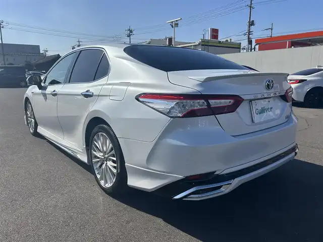 トヨタ カムリ G レザーパッケージ 岡山県 2018(平30)年 10.1万km プラチナホワイトパールマイカ 登録時走行距離101062km/パノラマルーフ/モデリスタフルエアロ/純正8インチナビ/フルセグTV(AM/FM/CD/DVD/Bluetooth)/バックカメラ/ビルトインETC/ヘッドアップディスプレイ/トヨタセーフティセンス/・レーダークルーズコントロール/・オートマチックハイビーム/・プリクラッシュセーフティ/・レーンディバーチャーアラート/横滑り防止装置/電子パーキング/オートブレーキホールド/D/N席パワーシート/D/N席シートヒーター/本革シート/純正フロアマット/18インチ純正AW