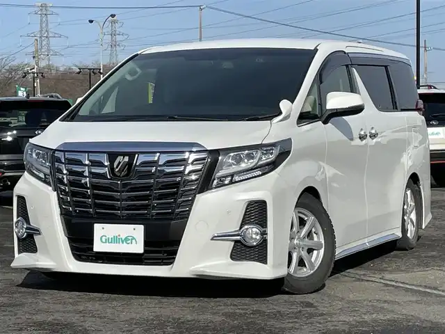トヨタ アルファード SA Cパッケージ 道央・札幌 2017(平29)年 6万km ホワイトパールクリスタルシャイン ４WD/寒冷地仕様/ALPINE11インチナビ/CD/DVD/BT/フルセグ/ALPINE12.8インチフリップダウンモニター/横滑り防止装置/クルーズコントロール/クリアランスソナー/バックカメラ/ビルトインETC/ドライブレコーダー/アイドリングストップ/ワイパーデアイサー/ECOMODE/両側パワースライドドア/パワーバックドア/前席/２列目パワーシート/D席メモリーシート/前席シートヒーター/革巻きステアリング/ステアリングリモコン/ハンドルヒーター/AC100V/電動パーキング/ブレーキホールド/MTモード付AT/プッシュスタート/スマートキー/LEDヘッドライト/オートライト/オートハイビーム/フォグランプ/電動格納ミラー/ウィンカーミラー/社外フロアマット/ドアバイザー