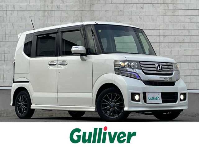 ホンダ Ｎ ＢＯＸ カスタム G ターボSSパッケージ 山形県 2014(平26)年 10.3万km プレミアムホワイトパール 禁煙車/4WD/純正メモリーナビ/・TV/AM/FM/CD/DVD/Bluetooth/クルーズコントロール/アイドリングストップ/衝突被害軽減ブレーキ/横滑り防止装置/盗難防止装置/HIDヘッドライト/オートライト/フロントフォグランプ/両側パワースライドドア/バックカメラ/シートヒーター（D/N席）/パドルシフト/プッシュスタート/スマートキー/純正ドアバイザー/純正フロアマット/ETC/夏タイヤ積み込み/保証書/取扱説明書