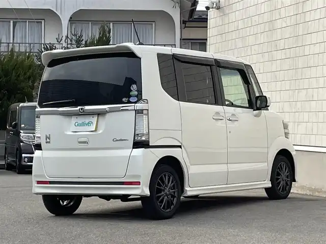 ホンダ Ｎ ＢＯＸ カスタム G ターボSSパッケージ 山形県 2014(平26)年 10.3万km プレミアムホワイトパール 禁煙車/4WD/純正メモリーナビ/・TV/AM/FM/CD/DVD/Bluetooth/クルーズコントロール/アイドリングストップ/衝突被害軽減ブレーキ/横滑り防止装置/盗難防止装置/HIDヘッドライト/オートライト/フロントフォグランプ/両側パワースライドドア/バックカメラ/シートヒーター（D/N席）/パドルシフト/プッシュスタート/スマートキー/純正ドアバイザー/純正フロアマット/ETC/夏タイヤ積み込み/保証書/取扱説明書