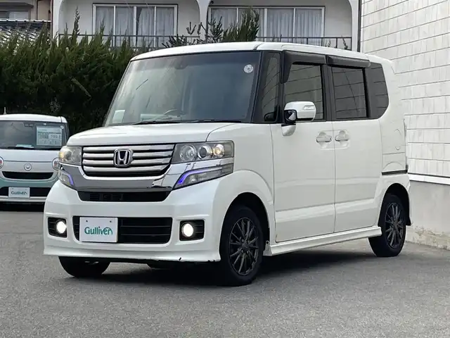 ホンダ Ｎ ＢＯＸ カスタム G ターボSSパッケージ 山形県 2014(平26)年 10.3万km プレミアムホワイトパール 禁煙車/4WD/純正メモリーナビ/・TV/AM/FM/CD/DVD/Bluetooth/クルーズコントロール/アイドリングストップ/衝突被害軽減ブレーキ/横滑り防止装置/盗難防止装置/HIDヘッドライト/オートライト/フロントフォグランプ/両側パワースライドドア/バックカメラ/シートヒーター（D/N席）/パドルシフト/プッシュスタート/スマートキー/純正ドアバイザー/純正フロアマット/ETC/夏タイヤ積み込み/保証書/取扱説明書