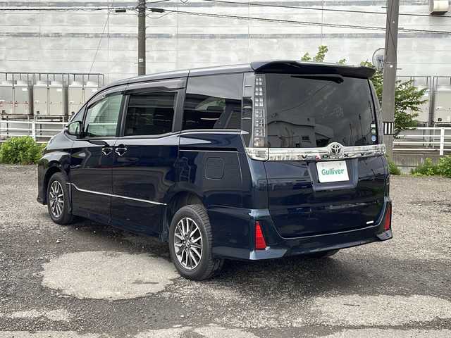 トヨタ ヴォクシー ZS 新潟県 2014(平26)年 3.9万km ブラッキッシュアゲハガラスフレーク 4WD/純正9インチSDナビ(NSZT-Y62G)/CD/DVD/BT/フルセグテレビ/フリップダウンモニター/バックカメラ/ETC/両側パワースライドドア/ステアリングスイッチ/MTモード付きAT/スマートキー/プッシュスタート/LEDヘッドライト/オートライト/フォグランプ/純正16インチアルミホイール