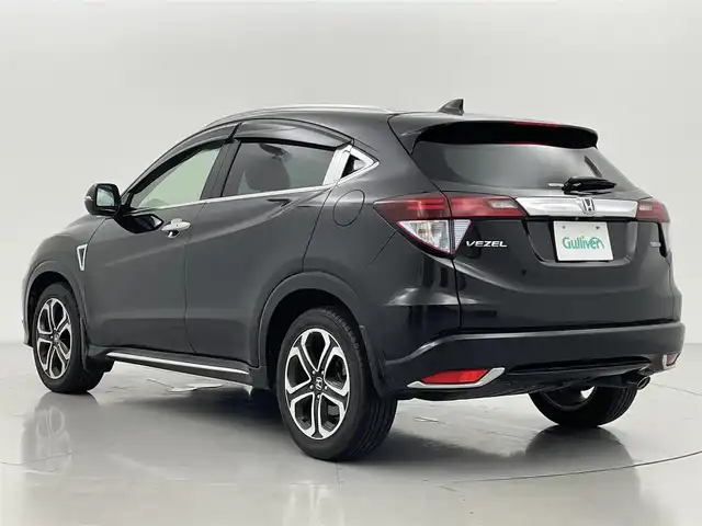 ホンダ ヴェゼル ハイブリッド Z ホンダセンシング 熊本県 2016(平28)年 5.1万km クリスタルブラックパール 純正ナビVXM-165VFi（ＣＤ・ＤＶＤ・フルセグ・ＢＴ）/バックカメラ　/アルパインフリップダウンモニター　/ビルトインＥＴＣ　/前席シートヒーター　/ホンダセンシング/・衝突軽減ブレーキ　/・レーンキープアシスト/・標識認識システム/・路外逸脱制御機能/・アダブティブクルーズコントロール/・先行車発進お知らせ/横滑り防止/パドルシフト/ハーフレザーシート/純正フロアマット/純正１７インチAW/オートライト/LEDヘッドライト/スマートキー/プッシュスタート