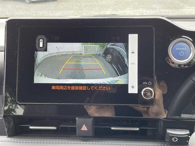 トヨタ ヴォクシー ハイブリッド S－Z 埼玉県 2023(令5)年 2万km ホワイトパールクリスタルシャイン ワンオーナー/メーカーオプションナビ(FM/AM/USB/BT/Wi-Fi/Miracast)/イモビライザー/デジタルミラー型ドラレコ/バックカメラ/アラウンドビューモニター/フリップダウンモニター/パーキングアシスト/サンシェード/オートライト/衝突軽減ブレーキ/電動格納ミラー/三列シート/シートヒーター(前・中シート)/両側スライドドア/オットマン/純正フロアマット/クルーズコントロール(追従)/横滑り防止/ISOFIX/ドアバイザー