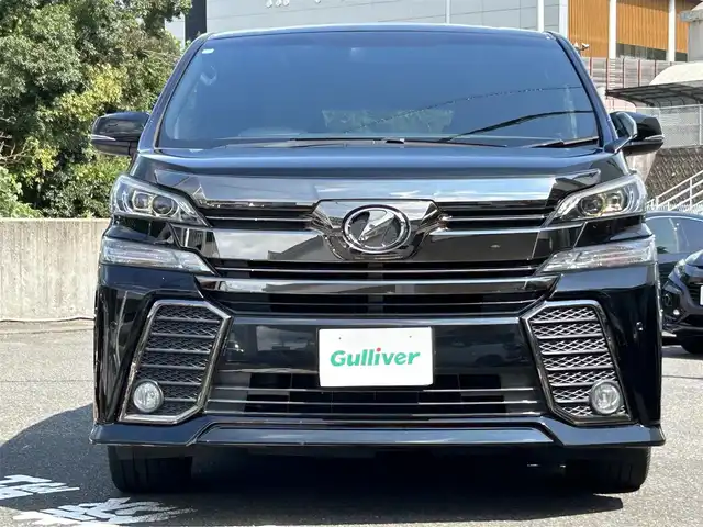 トヨタ ヴェルファイア Z Aエディション ゴールデンアイズ 長崎県 2017(平29)年 9.6万km ブラック 純正SDナビ(FM/AM/フルセグ/BT/CD/DVD)/バックカメラ/プッシュスタート/スマートキー/ビルトインETC/純正フロアマット/純正18インチアルミホイール/ドアバイザー/社外フリップダウンモニター/2列目オットマン/ルーフカラーイルミネーション/両側パワスラ/パワーバックドア/ABS/横滑り防止装置/盗難防止装置/オートライト/SRSダブル・サイドエアバッグ/SRSカーテンエアバッグ/ISOFIX/取扱説明書/保証書/スペアキー