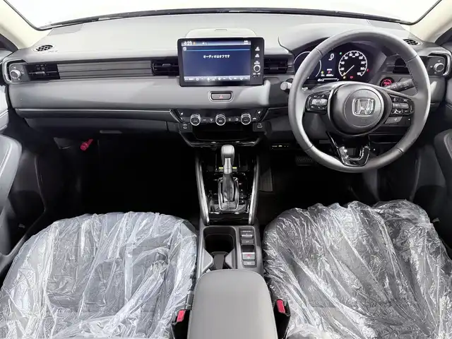 ホンダ ヴェゼル ハイブリッド e:HEV Z 大阪府 2025(令7)年 0.1千km クリスタルブラックパール 登録済未使用　純正ナビ　フルセグＴＶ　衝突軽減Ｂ　レーンアシスト　ＢＳＭ　レーダークルーズＣ　バックカメラ　ＥＴＣ　電動リアゲート　コーナーセンサー　ハンドルヒーター　シートヒーター　ハーフレザー