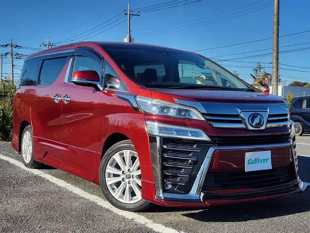 トヨタ ヴェルファイア Z Aエディション 群馬県 2018(平30)年 1.8万km ダークレッドマイカメタリック 純正10型ナビ/フルセグTV/純正12.1型後席ディスプレイ/両側パワースライドドア/バックモニター/ビルトインETC2.0/ドライブレコーダー/レーダークルーズコントロール/クリアランスソナー/セーフティセンス/・衝突被害軽減ブレーキ/・車線逸脱防止支援/・標識認識/・オートマチックハイビーム/2眼LEDヘッドランプ/デュアルオートエアコン/革巻きステアリング/2列目リラックスキャプテンシート/助手席・2列目オットマン/純正18インチアルミホイール/スマートキー/プッシュエンジンスタート/禁煙車