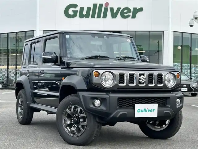 スズキ ジムニー ノマド FC 長崎県 2025(令7)年 0.1万km 黒 車体色：【WB3】ブルーイッシュブラックパール/ワンオーナー/ALPINE11インチディスプレイオーディオ/　(BT/FM/AM/AppleCarPlay/AndroidAuto)/プッシュスタート/スマートキー/ステアリングスイッチ/アダプティブクルーズコントロール/アイドリングストップ/ヘッドライトウォッシャー/光軸調整ダイヤル/純正15インチアルミホイール/純正フロアマット/背面タイヤ/スズキセーフティサポート/ABS/レーンキープアシスト/衝突被害軽減ブレーキ/パーキングソナー/オートライト/横滑り防止装置/ヒルディセントコントロール/取扱説明書/保証書/スペアキー(1本)