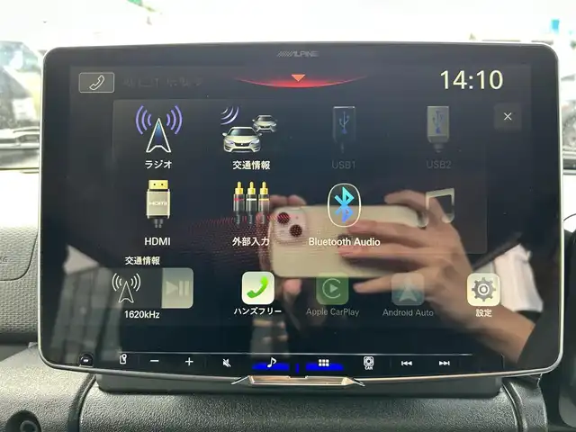 スズキ ジムニー ノマド FC 長崎県 2025(令7)年 0.1万km 黒 車体色：【WB3】ブルーイッシュブラックパール/ワンオーナー/ALPINE11インチディスプレイオーディオ/　(BT/FM/AM/AppleCarPlay/AndroidAuto)/プッシュスタート/スマートキー/ステアリングスイッチ/アダプティブクルーズコントロール/アイドリングストップ/ヘッドライトウォッシャー/光軸調整ダイヤル/純正15インチアルミホイール/純正フロアマット/背面タイヤ/スズキセーフティサポート/ABS/レーンキープアシスト/衝突被害軽減ブレーキ/パーキングソナー/オートライト/横滑り防止装置/ヒルディセントコントロール/取扱説明書/保証書/スペアキー(1本)