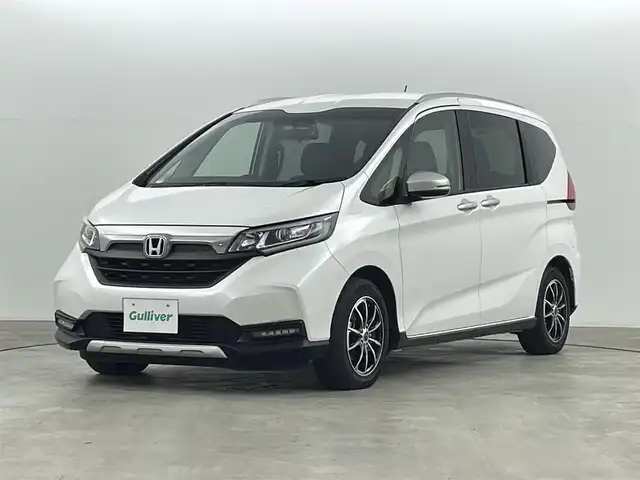 ホンダ フリード クロスター 福島県 2023(令5)年 4.1万km プラチナホワイトパール ホンダセンシング　/・衝突軽減ブレーキ　/・クルーズコントロール　/・路外逸脱抑制機能/・歩行者事故低減ステアリング/・先行車発進お知らせ/純正ナビゲーション/・型式：CN-HE02D/・Bluetooth/TV/CD/DVD/AM・FM/SD/USB/。バックカメラ/・ETC/前後ドライブレコーダー/両側パワースライドドア/革巻きステアリング/・ステアリングスイッチ/シートヒーター/プッシュスタート/・スマートキー/LEDライト/・フォグライト/・オートライト/純正フロアマット