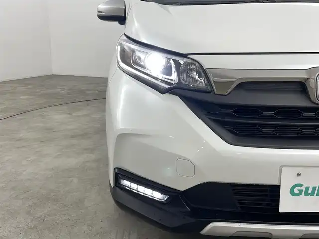 ホンダ フリード クロスター 福島県 2023(令5)年 4.1万km プラチナホワイトパール ホンダセンシング　/・衝突軽減ブレーキ　/・クルーズコントロール　/・路外逸脱抑制機能/・歩行者事故低減ステアリング/・先行車発進お知らせ/純正ナビゲーション/・型式：CN-HE02D/・Bluetooth/TV/CD/DVD/AM・FM/SD/USB/。バックカメラ/・ETC/前後ドライブレコーダー/両側パワースライドドア/革巻きステアリング/・ステアリングスイッチ/シートヒーター/プッシュスタート/・スマートキー/LEDライト/・フォグライト/・オートライト/純正フロアマット