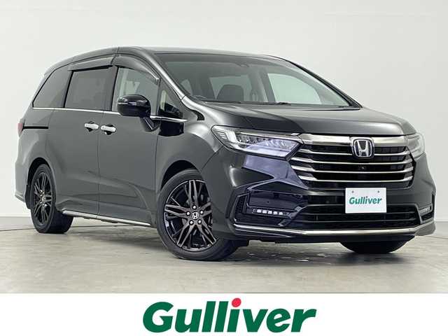 ホンダ オデッセイ ハイブリッド e:HEVアブソルート EX 岐阜県 2020(令2)年 4.9万km プレミアムスパークルブラックパール 純正10インチインターナビ/・フルセグ/BT/CD/DVD/HDMI/マルチビューモニター/フリップダウンモニター/前後ドライブレコーダー/両側パワースライドドア/パワーバックドア/ETC2.0/ハーフレザーシート/・パワーシート/・オットマン/ホンダセンシング/・衝突軽減ブレーキ/・誤発進抑制機能(前方・後方)/・近距離衝突軽減ブレーキ/・急アクセル抑制機能/・路外逸脱抑制機能/・歩行者事故低減ステアリング/・車線維持支援システム/・標識認識機能/・先行車発進お知らせ機能/・渋滞追従機能付きアダプティブクルーズコントロール/・ブラインドスポットインフォメーション/LEDヘッドライト/・フォグランプ/プッシュスタート/スマートキー/純正フロアマット/純正ドアバイザー