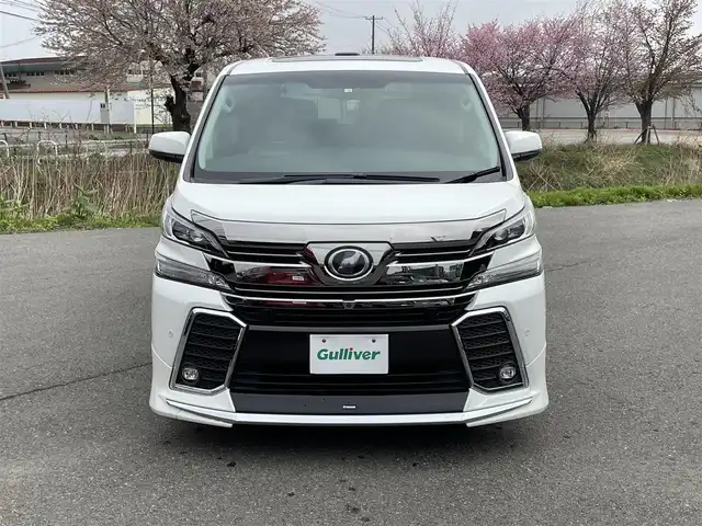 トヨタ ヴェルファイア Z Gエディション 山形県 2016(平28)年 7.3万km ホワイトパールクリスタルシャイン サンルーフ/JBLプレミアムサウンドシステム/純正SDナビ/　　【CD DVD BD BT フルセグ USB AUX】/全周囲カメラ/両側パワースライドドア/電動リアゲート/レーダークルーズコントロール/LEDオートヘッドライト/レザーシート/パワーシート/シートヒーター/オットマン/モデリスタエアロ/純正18インチアルミホイール/アイドリングストップ/コーナーセンサー/ステアリングスイッチ/MTモード付AT/電動格納ウィンカーミラー/フォグランプ/スマートキー/ETC