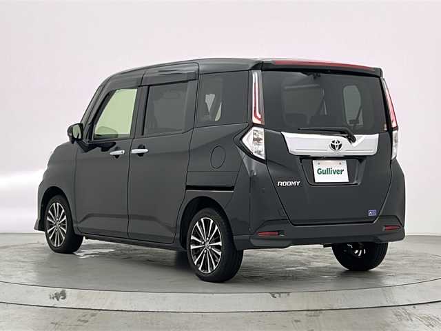 トヨタ ルーミー カスタムG－T 宮城県 2022(令4)年 1.9万km ブラックマイカメタリック 純正９インチナビ(CD/DVD/BT/フルセグTV)/両側パワースライドドア　/スマートアシスト/　・アダプティブクルーズコントロール　/　・車線逸脱警報機能　/　・衝突被害軽減ブレーキ　/　・先行車発進お知らせ/　・標識認識機能/　・オートハイビーム/　・アダプティブドライビングビーム/　・前後コーナーセンサー/オートライト　/ＬＥＤライト　/IC付ターボ/電動パーキングブレーキ/ブレーキホールド/前席シートヒーター　/リアサンシェード/レザーステアリング/プッシュスタート/スマートキー/純正フロアマット/サイドバイザー/純正アルミホイール