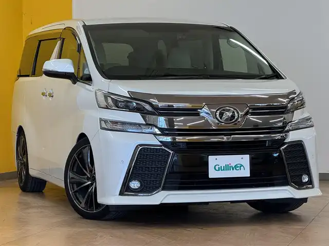 トヨタ ヴェルファイア V 群馬県 2015(平27)年 7.2万km ホワイトパールクリスタルシャイン 純正9インチSDナビ/・フルセグTV(TVキャンセラー)/・CD/DVD/BT/・SD/USB/AM.FM/パノラミックビューモニター/純正フリップダウンモニター /JBLプレミアムサウンド/HKSサスペンション(純正サス有)/プリクラッシュセーフティ/レーダークルーズコントロール/コーナーセンー/ビルトインETC/前後ドライブレコーダー/GPSレーダー/純正17インチAW積込/電動パーキングブレーキ/オートホールド/ウッドコンビハンドル/ステアリングスイッチ/オットマン/D席メモリ付パワーシート/スマートキー/プッシュスタート/LEDヘッドライト/フォグランプ/オートライト/AC100V/社外20インチAW/純正フロアマット/純正ドアバイザー/電動格納ウィンカーミラー/横滑り防止システム