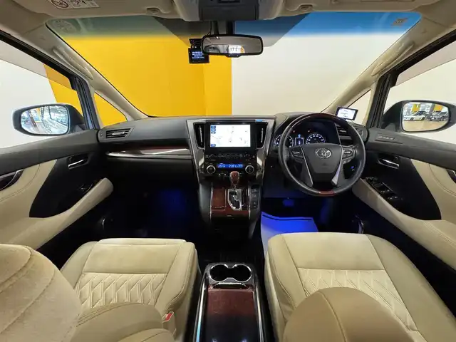 トヨタ ヴェルファイア V 群馬県 2015(平27)年 7.2万km ホワイトパールクリスタルシャイン 純正9インチSDナビ/・フルセグTV(TVキャンセラー)/・CD/DVD/BT/・SD/USB/AM.FM/パノラミックビューモニター/純正フリップダウンモニター /JBLプレミアムサウンド/HKSサスペンション(純正サス有)/プリクラッシュセーフティ/レーダークルーズコントロール/コーナーセンー/ビルトインETC/前後ドライブレコーダー/GPSレーダー/純正17インチAW積込/電動パーキングブレーキ/オートホールド/ウッドコンビハンドル/ステアリングスイッチ/オットマン/D席メモリ付パワーシート/スマートキー/プッシュスタート/LEDヘッドライト/フォグランプ/オートライト/AC100V/社外20インチAW/純正フロアマット/純正ドアバイザー/電動格納ウィンカーミラー/横滑り防止システム