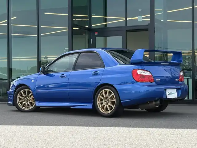 スバル インプレッサ ＷＲＸ STi 東京都 2003(平15)年 6.2万km WRブルーマイカ 純正BBS製17インチアルミ/STI製ストラットタワーバー/STI製３蓮メーター/TEIN製車高調キット/トラスト製マフラー/ブリッツ製エアクリーナー/ブリッツ製インタークーラー/ブリッツ製ラジエター/ないる屋製Frバンパー/ないる屋製サイドステップ/ないる屋製Frフェンダー/ないる屋製ボンネット/純正DVDナビ/ETC/純正フロアマット/HIDヘッドライト/保証書/整備記録簿/取扱説明書