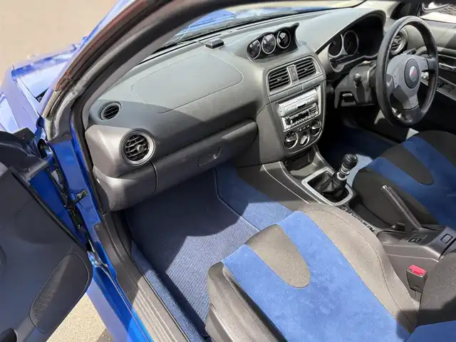 スバル インプレッサ ＷＲＸ STi 東京都 2003(平15)年 6.2万km WRブルーマイカ 純正BBS製17インチアルミ/STI製ストラットタワーバー/STI製３蓮メーター/TEIN製車高調キット/トラスト製マフラー/ブリッツ製エアクリーナー/ブリッツ製インタークーラー/ブリッツ製ラジエター/ないる屋製Frバンパー/ないる屋製サイドステップ/ないる屋製Frフェンダー/ないる屋製ボンネット/純正DVDナビ/ETC/純正フロアマット/HIDヘッドライト/保証書/整備記録簿/取扱説明書