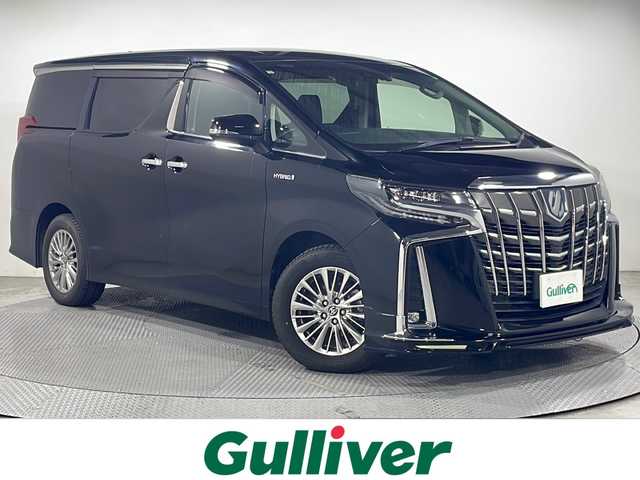 トヨタ アルファードハイブリット SR 広島県 2021(令3)年 3.9万km ブラック 社外フロントエアロ/JBLプレミアムサウンド/純正10型ナビ/パノラミックビューモニター/3眼LEDヘッドランプ/パワーバックドア/両側パワースライドドア/パワーシート/ポジションメモリー/シートヒーター/ベンチレーション/オットマン/セーフティセンス/・プリクラッシュセーフティ/・レーントレーシングアシスト/・オートマチックハイビーム/・レーダークルーズコントロール/ブラインドスポットモニター/パーキングアシスト/パーキングサポートブレーキ/ALPINEデジタルインナーミラー型ドラレコ/ETC2.0