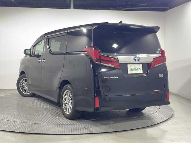 トヨタ アルファードハイブリット SR 広島県 2021(令3)年 3.9万km ブラック 社外フロントエアロ/JBLプレミアムサウンド/純正10型ナビ/パノラミックビューモニター/3眼LEDヘッドランプ/パワーバックドア/両側パワースライドドア/パワーシート/ポジションメモリー/シートヒーター/ベンチレーション/オットマン/セーフティセンス/・プリクラッシュセーフティ/・レーントレーシングアシスト/・オートマチックハイビーム/・レーダークルーズコントロール/ブラインドスポットモニター/パーキングアシスト/パーキングサポートブレーキ/ALPINEデジタルインナーミラー型ドラレコ/ETC2.0