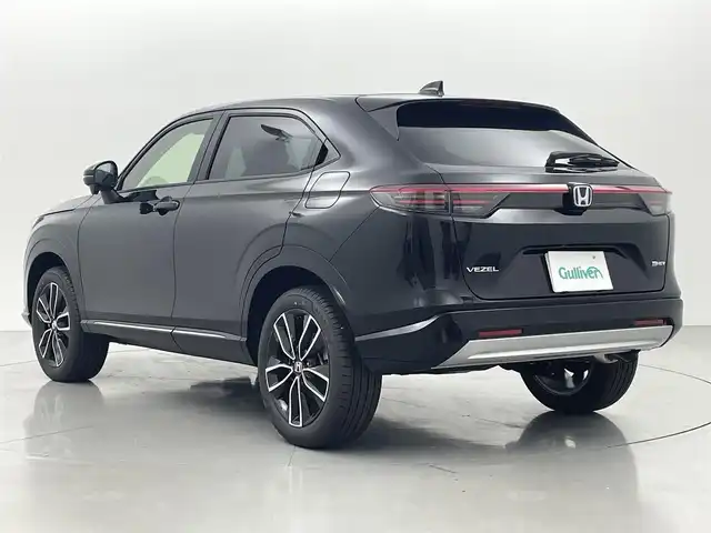 ホンダ ヴェゼル ハイブリッド e:HEV Z 熊本県 2025(令7)年 0.1万km未満 クリスタルブラックパール 登録済未使用車/純正ナビ（ＡｐｐｌＣａｒＰｌａｙ・ＡｎｄｒｏｉｄＡｕｔｏ・ＵＳＢ・ＢＴ・フルセグ）/ビルトインＥＴＣ２．０　/前後クリアランスソナー　/ホンダセンシング/・衝突軽減ブレーキ/・踏み間違い防止/・急アクセル抑制機能/・路外逸脱抑制機能/・歩行者事故低減ステアリング/・アダブティブクルーズコントロール/・車線維持支援システム/・先行車発進お知らせ/・標識認識システム/・ブラインドスポットモニター/・オートマチックハイビーム/ダウンヒルアシスト/横滑り防止/パワーバックドア/前席シートヒーター/ステアリングヒーター/置くだけ充電/パドルシフト/ハーフレザーシート/純正１８インチAW/オートライト/LEDヘッドライト/フォグライト/スマートキー/プッシュスタート/スペアキー1本/取扱説明書
