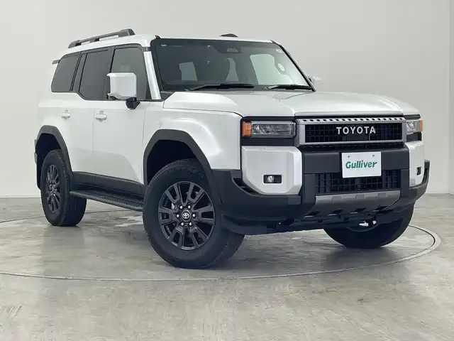 トヨタ ランドクルーザー ２５０ VX 群馬県 2024(令6)年 0.9万km プラチナホワイトパールマイカ サンルーフ　純正１２．３型ナビ　全周囲カメラ　アダプティブクルーズコントロール　衝突被害軽減ブレーキ　シートベンチレーション　シートヒーター　パワーシート　電動リアゲート　ＥＴＣ２．０　禁煙車