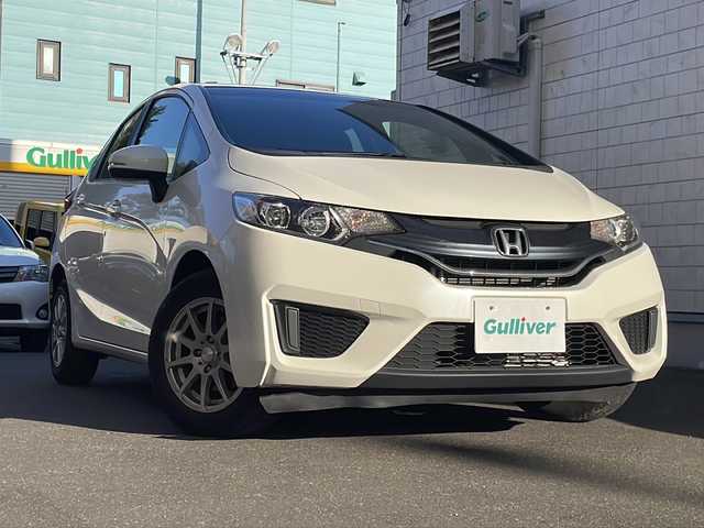 ホンダ フィット 13G Fパッケージ 道央・札幌 2014(平26)年 9.4万km プレミアムホワイトパール 純正ナビ/バックカメラ/ETC/オートライト/アイドリングストップ/電動格納ミラー/純正マット/横滑り防止