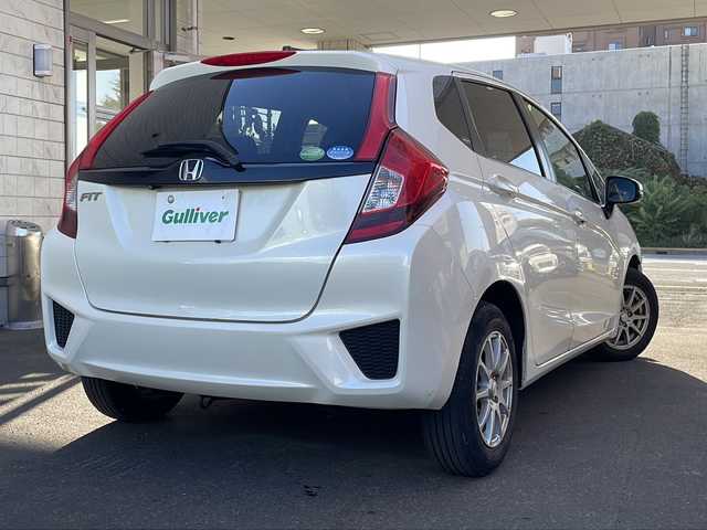 ホンダ フィット 13G Fパッケージ 道央・札幌 2014(平26)年 9.4万km プレミアムホワイトパール 純正ナビ/バックカメラ/ETC/オートライト/アイドリングストップ/電動格納ミラー/純正マット/横滑り防止