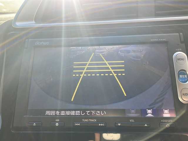 ホンダ フィット 13G Fパッケージ 道央・札幌 2014(平26)年 9.4万km プレミアムホワイトパール 純正ナビ/バックカメラ/ETC/オートライト/アイドリングストップ/電動格納ミラー/純正マット/横滑り防止