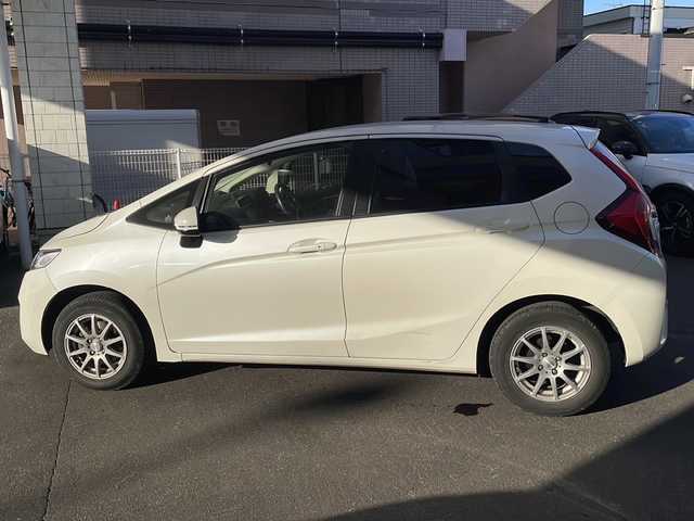 ホンダ フィット 13G Fパッケージ 道央・札幌 2014(平26)年 9.4万km プレミアムホワイトパール 純正ナビ/バックカメラ/ETC/オートライト/アイドリングストップ/電動格納ミラー/純正マット/横滑り防止
