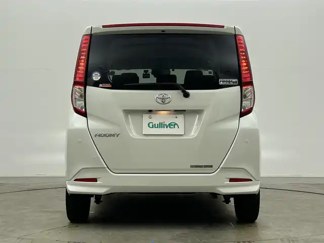 トヨタ ルーミー G－T 岡山県 2021(令3)年 2.1万km パールホワイトⅢ 純正９インチナビ/【Bluetooth/フルセグTV/CD/USB接続】/型番:NSZT-Y68T/パノラミックビューモニター/両側パワースライドドア/衝突軽減ブレーキ/社外ドライブレコーダー（前後）/クルーズコントロール/オートハイビーム/オートライト/ＬＥＤヘッドライト/フォグランプ/ビルトインETC/ドアバイザー/プッシュスタート/スマートキー×2