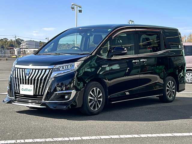 トヨタ エスクァイア ハイブリッド Gi プレミアムパッケージ 鹿児島県 2018(平30)年 7.1万km ブラック ディーラーオプション10インチナビ(NSZN-Z66T)/バックカメラ/フルセグテレビ/CD/DVD/BT/SD/FM.AM/プリクラッシュセーフティ/レーンディパーチャーアラート/オートマチックハイビーム/先行車発信告知/クルーズコントロール/両側パワースライドドア/ステアリングスイッチ/社外360度録画型ドライブレコーダー(HDR360G)/シートヒーター(運転席/助手席)/ビルトインETC/AC100V電源（センターコンソール後方）/前後コーナーセンサー/後席ロールサンシェード/純正フロアマット/純正ドアバイザー/純正15インチアルミホイール/スマートキー×2/エンジンスターター×1/保証書/取扱説明書