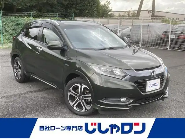ホンダ ヴェゼル ハイブリッド Z 埼玉県 2014(平26)年 11.9万km ミスティックグリーンパール (株)IDOMが運営する【じしゃロン鳩ヶ谷店】の自社ローン専用車両になりますこちらは現金またはオートローンご利用時の価格です。自社ローンご希望の方は別途その旨お申付け下さい/社外SDナビ(品番:MDV-D407BT)/社外フルセグテレビ/バックカメラ/クルーズコントロール/プッシュスタート/ETC/LEDヘッドライト/純正17インチAW/ハーフレザーシート/スマートキー/パドルシフト/革巻ステアリング/ウインカーミラー/フォグランプ
