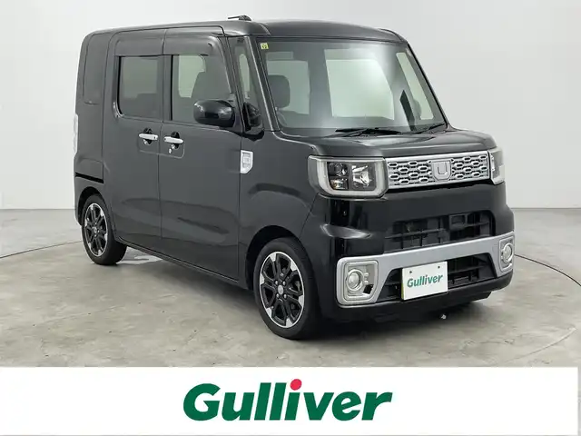ダイハツ ウェイク G SA 大分県 2014(平26)年 5.5万km ブラックマイカメタリック 社外ディスプレイオーディオ/（Bluetooth/CD/AM/FM）/バックカメラ/両側パワースライドドア/衝突軽減装置/電動格納ミラー/オートライト/HIDヘッドライト/黒革調シートカバー/プッシュスタート・スマートキー/保証書・取扱説明書
