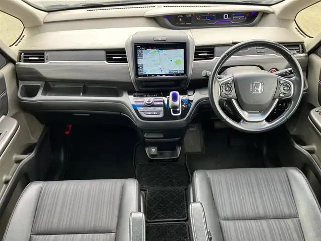 ホンダ フリード ハイブリット EX 静岡県 2017(平29)年 9.6万km クリスタルブラックパール 純正9インチナビ(CD/DVD/BT/フルセグ)/バックカメラ/エンジンスタートボタン/パワーステアリング/パワーウィンドウ/寒冷地仕様/アイドリングストップ/スマートキー/スペアキー１本/オートエアコン/レーダークルーズコントロール/後席モニター(VM-185EN)/純正ETC/ドライブレコーダー/ウォークスルー/社外フロアマット/ハーフレザーシート/D席N席シートヒーター/両側パワースライドドア/社外アルミホイール/ABS/横滑り防止装置/レーンキープアシスト/オートライト/LEDヘッドライト/W+サイドエアバッグ/カーテンエアバッグ/衝突軽減システム/パワステ不調(カクカクする)