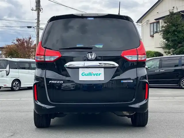 ホンダ フリード ハイブリット EX 静岡県 2017(平29)年 9.6万km クリスタルブラックパール 純正9インチナビ(CD/DVD/BT/フルセグ)/バックカメラ/エンジンスタートボタン/パワーステアリング/パワーウィンドウ/寒冷地仕様/アイドリングストップ/スマートキー/スペアキー１本/オートエアコン/レーダークルーズコントロール/後席モニター(VM-185EN)/純正ETC/ドライブレコーダー/ウォークスルー/社外フロアマット/ハーフレザーシート/D席N席シートヒーター/両側パワースライドドア/社外アルミホイール/ABS/横滑り防止装置/レーンキープアシスト/オートライト/LEDヘッドライト/W+サイドエアバッグ/カーテンエアバッグ/衝突軽減システム/パワステ不調(カクカクする)