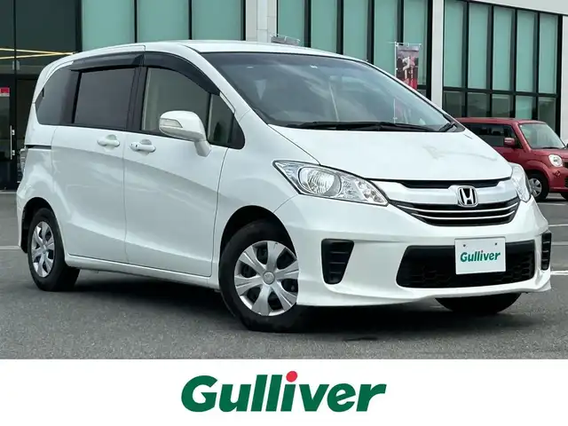 ホンダ フリード G プレミアムエディション 奈良県 2016(平28)年 1.5万km ホワイトオーキッドパール 純正ナビ/(AM/FN/CD/DVD/BT/iPod/USB/VTR/フルセグTV)/フリップダウンモニター/両側パワースライドドア/ハーフレザーシート/バックカメラ/クルーズコントロール/ビルトインETC/オートライト/横滑り防止装置/電格ウインカーミラー/フロアマット