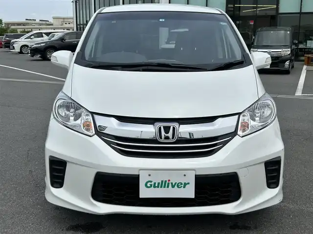 ホンダ フリード G プレミアムエディション 奈良県 2016(平28)年 1.5万km ホワイトオーキッドパール 純正ナビ/(AM/FN/CD/DVD/BT/iPod/USB/VTR/フルセグTV)/フリップダウンモニター/両側パワースライドドア/ハーフレザーシート/バックカメラ/クルーズコントロール/ビルトインETC/オートライト/横滑り防止装置/電格ウインカーミラー/フロアマット