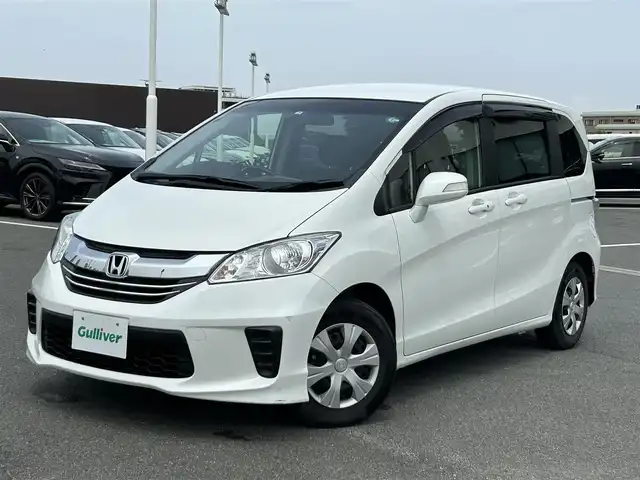 ホンダ フリード G プレミアムエディション 奈良県 2016(平28)年 1.5万km ホワイトオーキッドパール 純正ナビ/(AM/FN/CD/DVD/BT/iPod/USB/VTR/フルセグTV)/フリップダウンモニター/両側パワースライドドア/ハーフレザーシート/バックカメラ/クルーズコントロール/ビルトインETC/オートライト/横滑り防止装置/電格ウインカーミラー/フロアマット