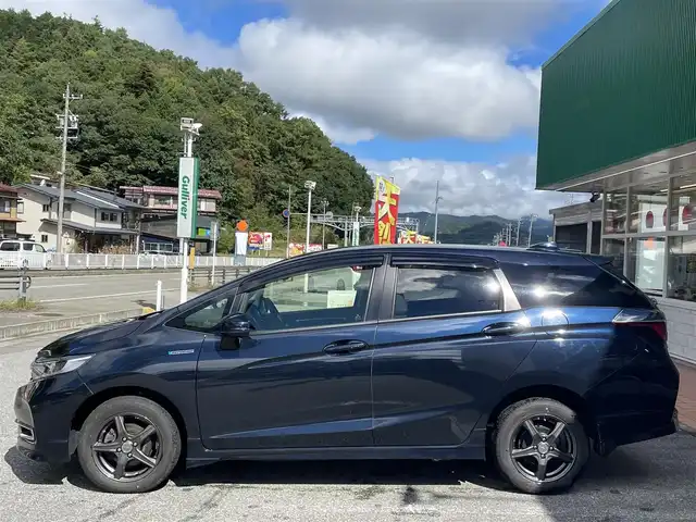 ホンダ シャトル ハイブリッド X ホンダセンシング 岐阜県 2021(令3)年 7.7万km ミッドナイトブルービームM 4WD/純正ナビ/【Bluetooth．CD.DVD.AM/FM．TV】/ホンダセンシング/クルーズコントロール/シートヒーター/スマートキー/ETC/ドライブレコーダー/バックカメラ/純正フロアマット/ウィンカーミラー/オートライト/フォグライト/ドアバイザー/保証書/取扱説明書/スペアキー