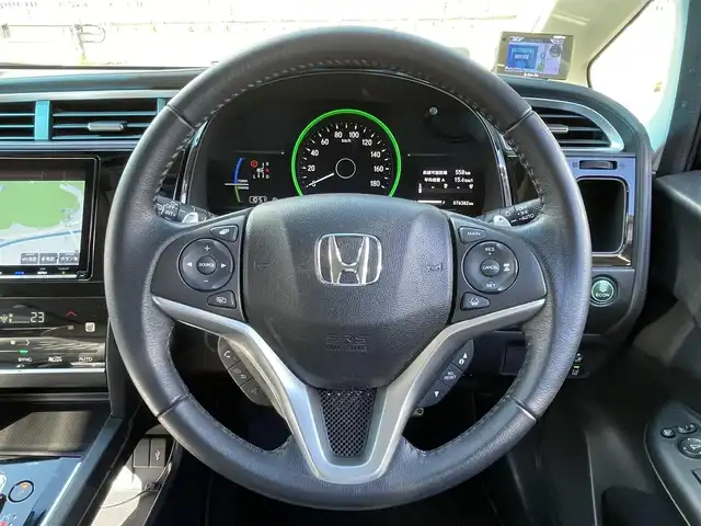 ホンダ シャトル ハイブリッド X ホンダセンシング 岐阜県 2021(令3)年 7.7万km ミッドナイトブルービームM 4WD/純正ナビ/【Bluetooth．CD.DVD.AM/FM．TV】/ホンダセンシング/クルーズコントロール/シートヒーター/スマートキー/ETC/ドライブレコーダー/バックカメラ/純正フロアマット/ウィンカーミラー/オートライト/フォグライト/ドアバイザー/保証書/取扱説明書/スペアキー