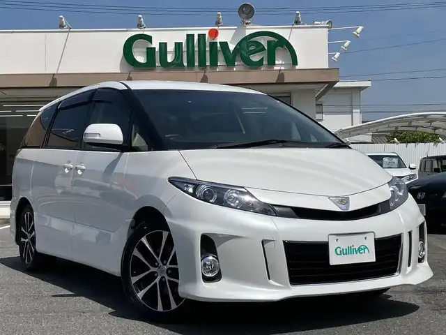 トヨタ エスティマ アエラス レザーパッケージ 三重県 2014(平26)年 4.9万km ホワイトパールクリスタルシャイン ♪走行48477km/純正8インチナビ/・フルセグ・CD録音/・DVD再生・SD/・Bluetoothオーティオ/ブルーレイディスクプレーヤー内蔵/　純正フリップダウンモニター/　・DVD/BD/SD/バックカメラ/両側パワースライドドア/スマートキー/プッシュスタート/黒革シート/パワーシート/前席シートヒーター/クルーズコントロール/HIDヘッドライト/フォグライト /オートライト/ウィンカーミラー /セカンドシートオットマン/革巻ステアリング/ステアリングスイッチ/ビルトインETC/ウッドパネル/ドライブレコーダー/レーダー探知機/プライバシーガラス/ドアバイザー/電格ミラー/フロアマット